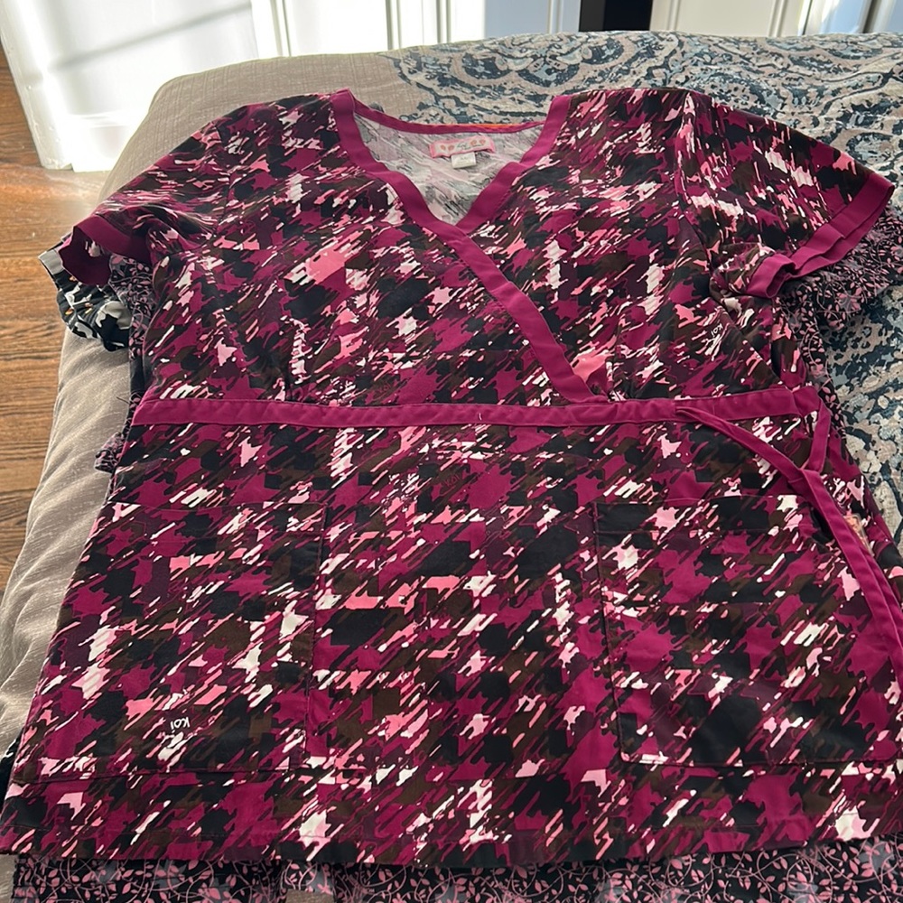 Purple scrub top with drawstring waist and two pockets